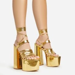 EGO Amazoness Lace Up Extreme Strappy Detail Platform Block Heel In Gold Patent