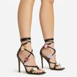EGO Flower-Child Lace Up Strappy 3D Flower Detail Square Toe Stiletto Heel In Black Faux Leather