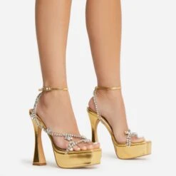 EGO Show-Ahead Clear Perspex Strap Diamante Detail Platform Flared Block Heel In Gold Faux Leather