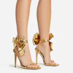 EGO Beau Oversized Bow Detail Square Toe Stiletto Heel In Gold Faux Leather