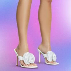 EGO Bouquet Oversized Diamante Rose Detail Thong Strap Square Toe Stiletto Heel Mule In White Faux Leather